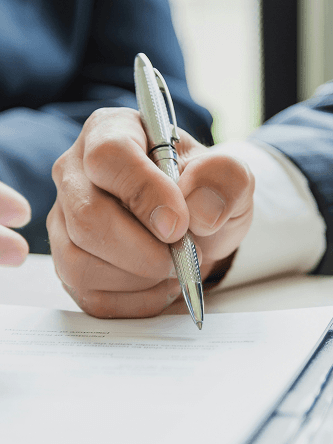 Investor signing a financing document